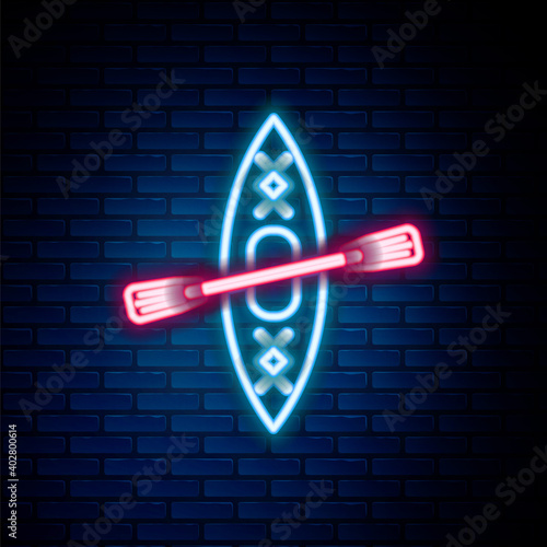 Glowing neon line Kayak and paddle icon isolated on brick wall background. Kayak and canoe for fishing and tourism. Outdoor activities. Colorful outline concept. Vector.