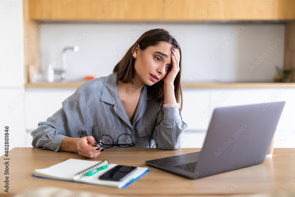 Young woman working with papers at home Young woman working with papers at home