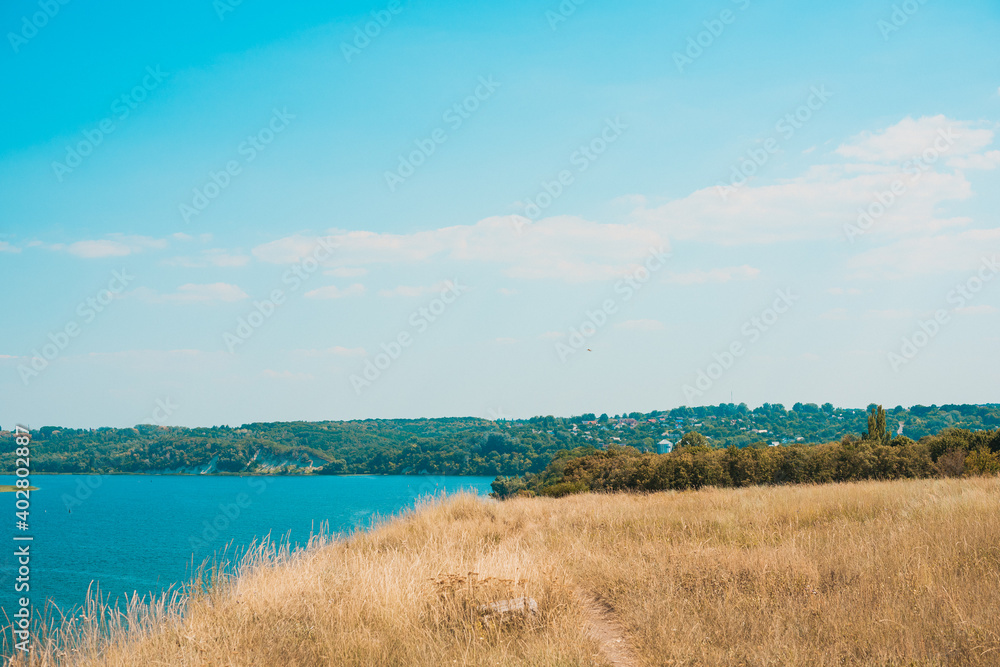 Nature view, beautiful landscape, field and sky, river. Concept of adventures