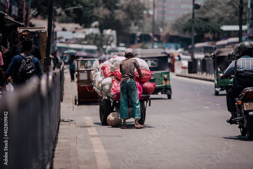 Obraz na płótnie COLOMBO, SRI LANKA - APRIL 03, 2019: Street near the Pettah Market or Manning Market. Pettah Market located in the suburb of Pettah in Colombo, Sri Lanka. w salonie