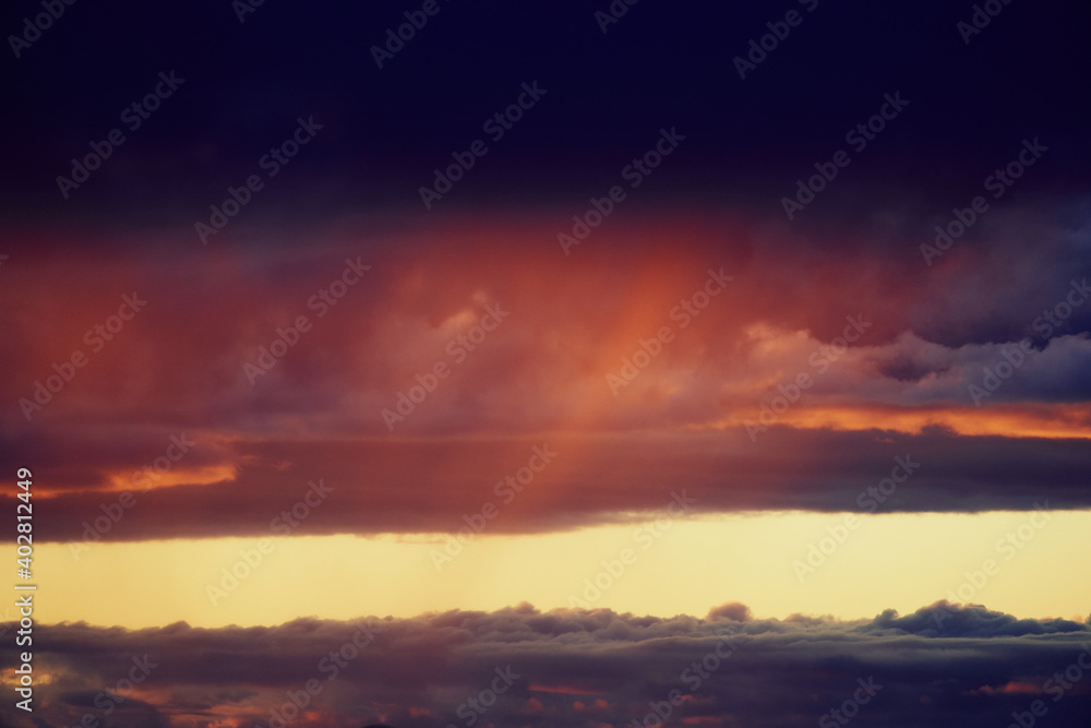 sky at sunset with rain showers