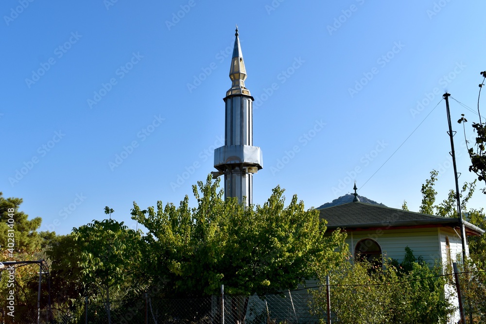 minaret of mosque in the forest