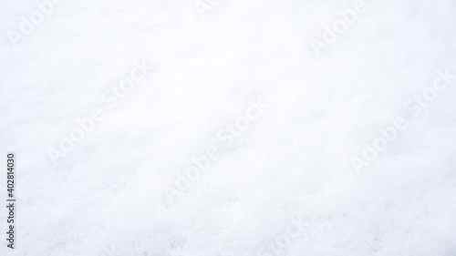Fresh snow background in sunny winter day. White background with copy space. © Jessica