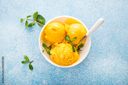 Konstfotografi Mango ice cream, sorbet in a plate on a concrete background