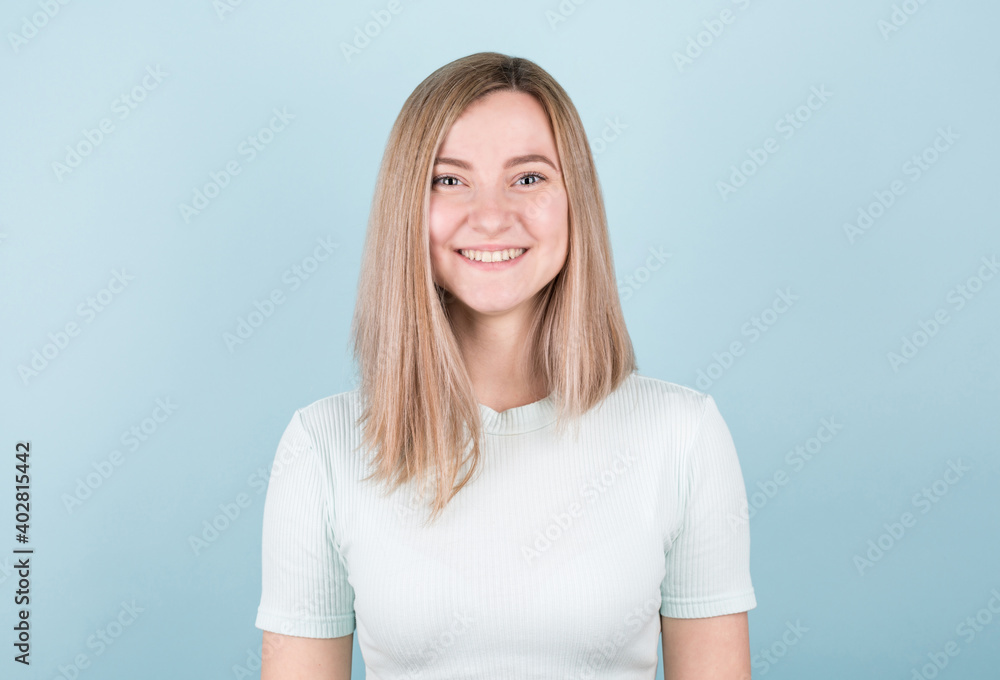 Happy cheerful young blonde teen looking at camera with joyful and charming smile. Happy cheerful young blonde teen looking at camera with joyful and charming smile.