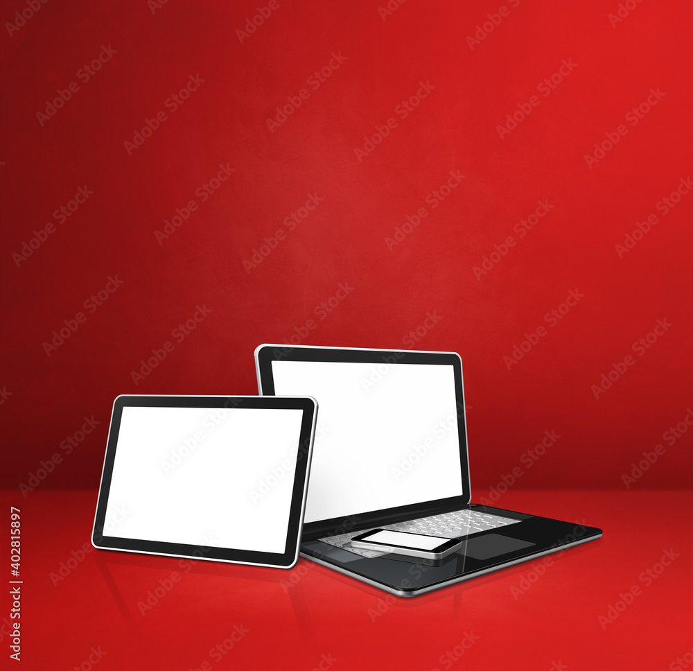 Laptop, mobile phone and digital tablet pc on red office desk Laptop, mobile phone and digital tablet pc on red office desk