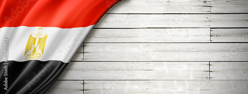 Egyptian flag on old white wall banner photo