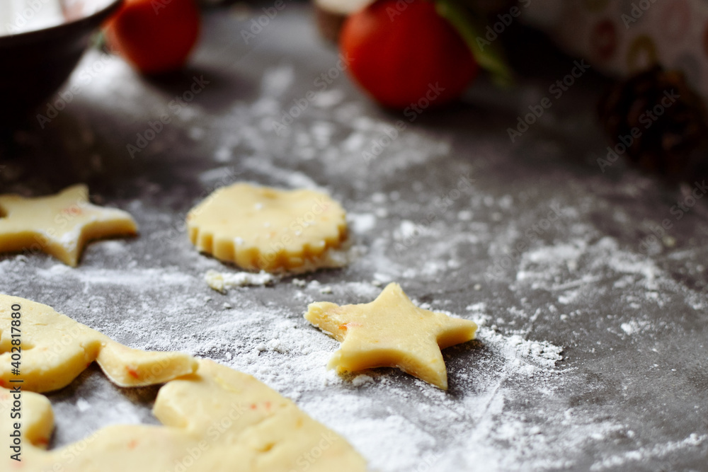 Cooking cookies for the new year and christmas. Flour and dough, cookie cutters. Top view. Copy space Cooking cookies for the new year and christmas. Flour and dough, cookie cutters. Top view. Copy space