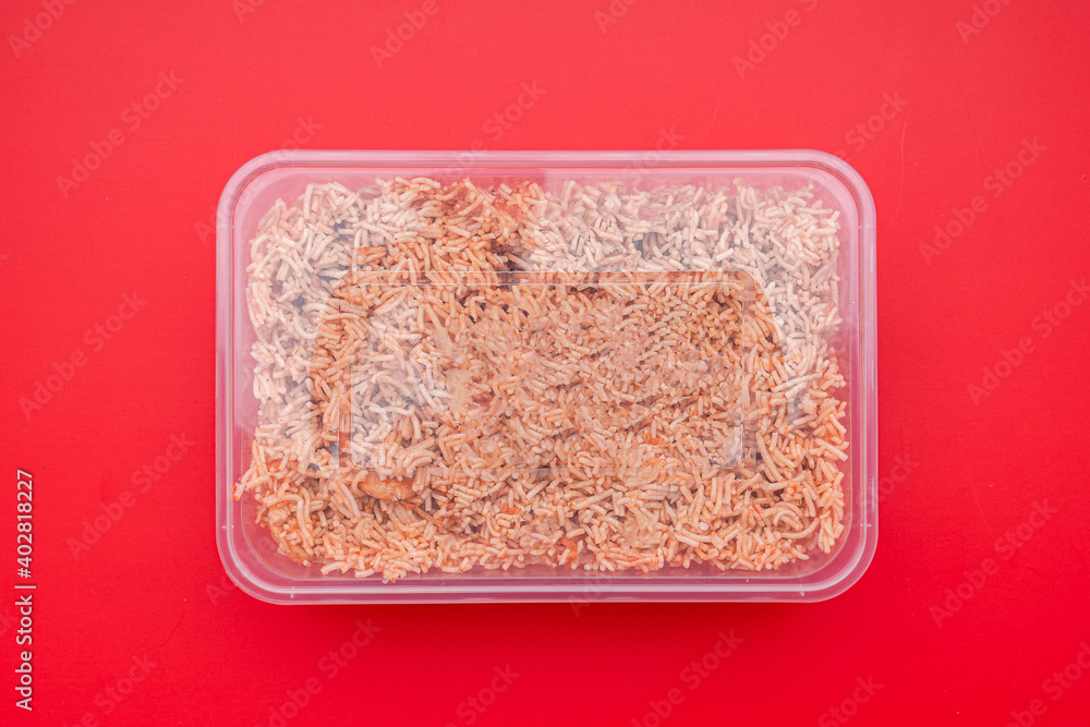 A box of sweet and sour crispy noodles (or Mee krob in the Thai language) on a red background. Top view with copy space for text. Package for sale A box of sweet and sour crispy noodles (or Mee krob in the Thai language) on a red background. Top view with copy space for text. Package for sale