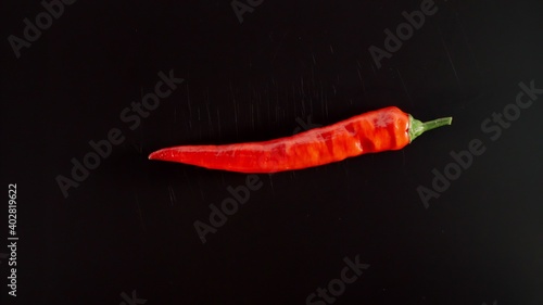 Fresh Red Chili Pepper On A Black Table