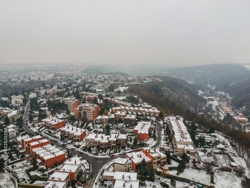 Aerial view of row houses in residential area of Baba in Dejvice in witner with snow on the flat roofs