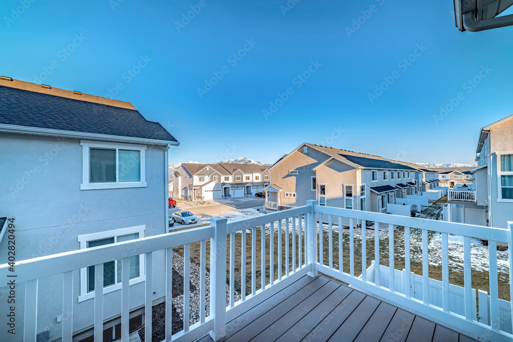 Townhouses at a sunny residential neighborhood viewed from the deck of a home
