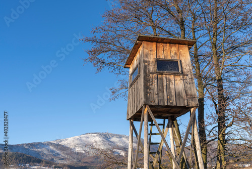 Wooden high tower for hunters in the fields in the mountains © Tomasz