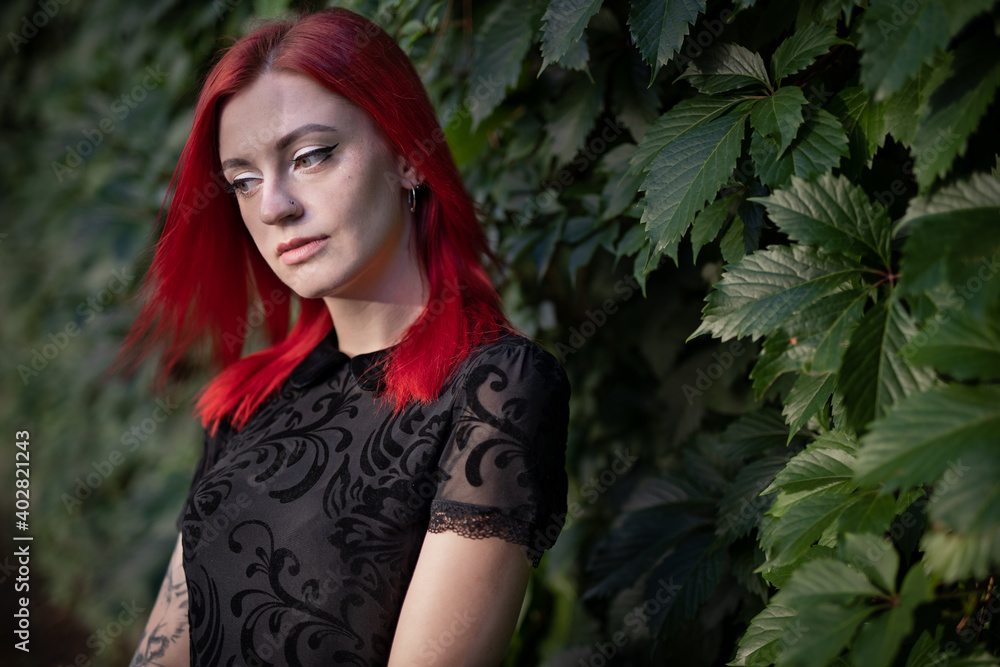 red haired girl in dress walks in park red haired girl in dress walks in park