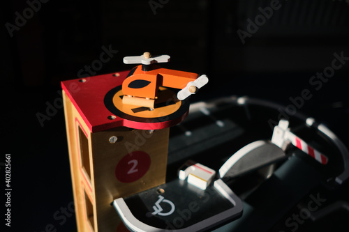 Children's wooden toy helicopter and garage.