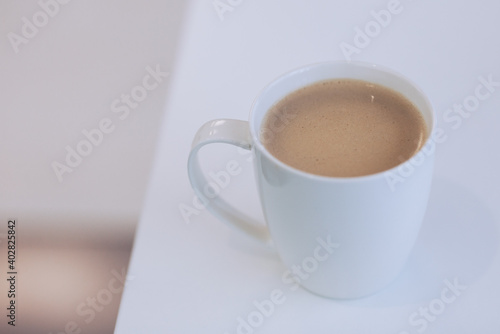 white mug full of coffeee