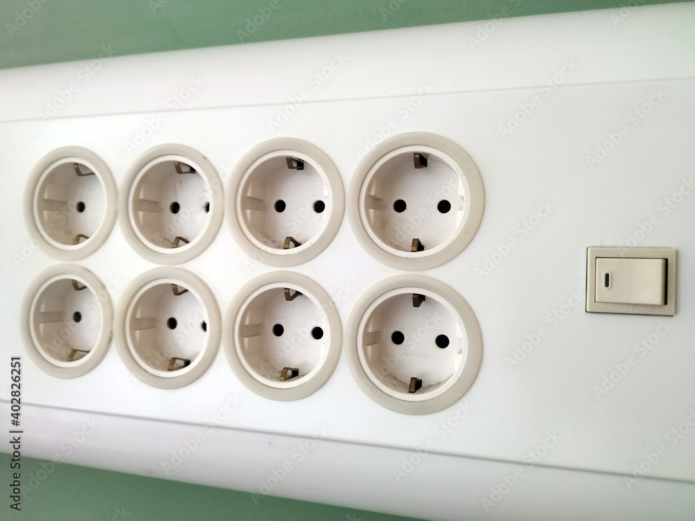 six sockets on a green wall. for electric appliance six sockets on a green wall. for electric appliance