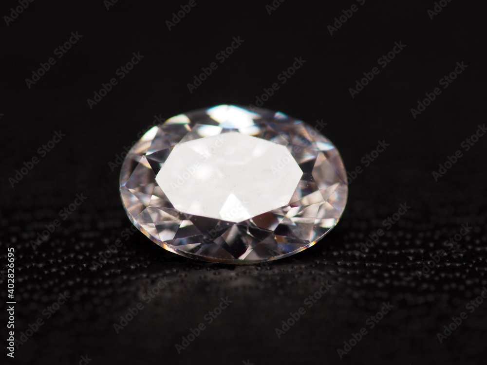 Close up shoot of group of sparkling diamonds, shoot on black leather as background Close up shoot of group of sparkling diamonds, shoot on black leather as background