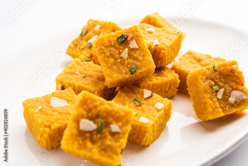 Besan Moong Dal Burfi is made with yellow lentil, chickpea flour. Popular Indian festival sweet photo