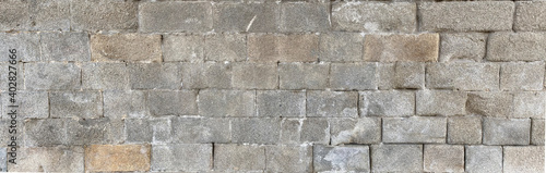 Old castle stone wall texture background. Texture of a stone wall. Stone wall as a background or texture. Part of a stone wall, for background or texture.