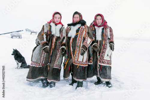 Yamalo-Nenets Autonomous Okrug, extreme north, Nenets family in the national winter clothes of the northern inhabitants of the tundra, the Arctic circle photo