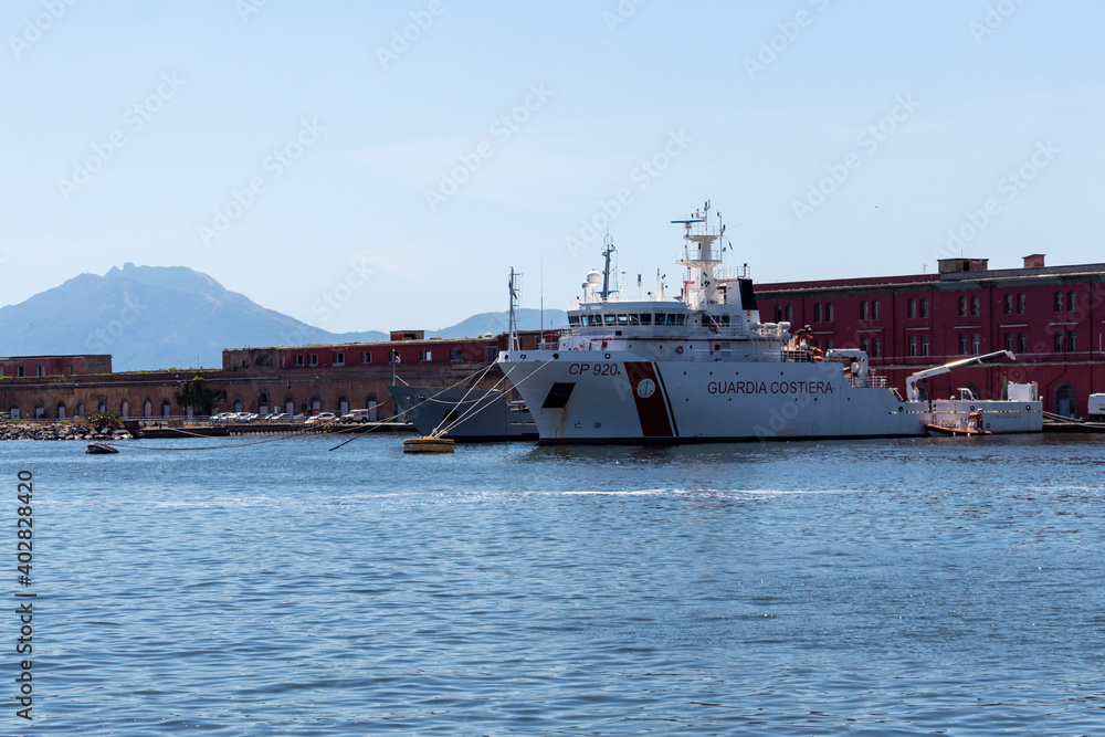 Naples, Italy - July 14, 2019: Dattilo-class patrol boat - an italian coast guard vessel, which have responsibility for enforcement of shipping, maritime safety regulations, search and rescue duties. Naples, Italy - July 14, 2019: Dattilo-class patrol boat - an italian coast guard vessel, which have responsibility for enforcement of shipping, maritime safety regulations, search and rescue duties.