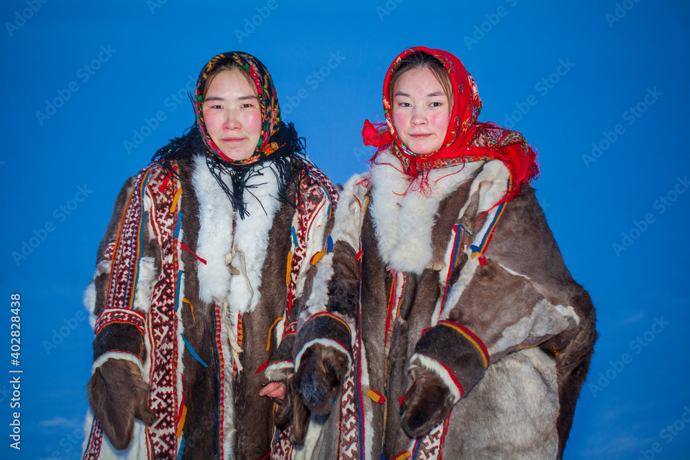 Yamalo-Nenets Autonomous Okrug, extreme north, Nenets family in the national winter clothes of the northern inhabitants of the tundra, the Arctic circle
