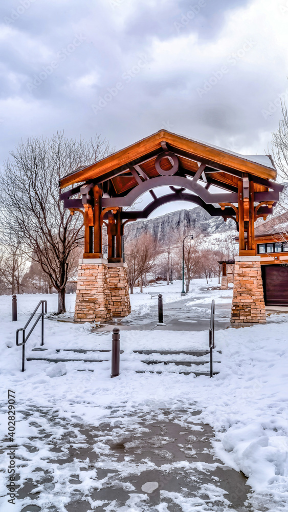 Pavilion with steps against snowy mountain and cloudy sky background in winter Pavilion with steps against snowy mountain and cloudy sky background in winter