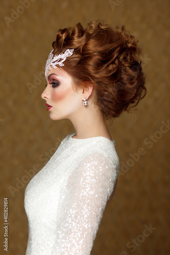 Profile Portrait of a Beautiful Wedding Hairstyle of Woman. High Fashion Coiffure. Close Up of Hairdo