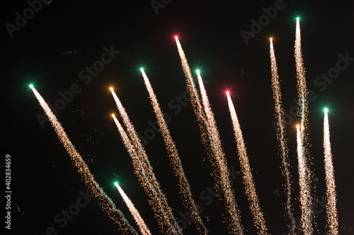Background of fireworks exploding in the sky at night to celebrate holiday