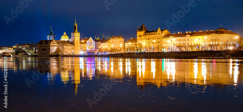 Panoramic view on Karlovy Lazne, Museum of Bendrich Smetana with reflection in Vltava River, Prague, Czech Republic