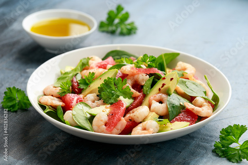 Fresh Avocado Grapefruit shrimp salad in white plate