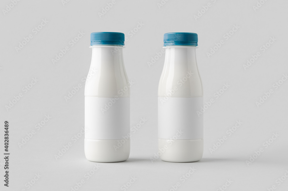 White plastic yogurt or milk bottle mockup with blank label. White plastic yogurt or milk bottle mockup with blank label.