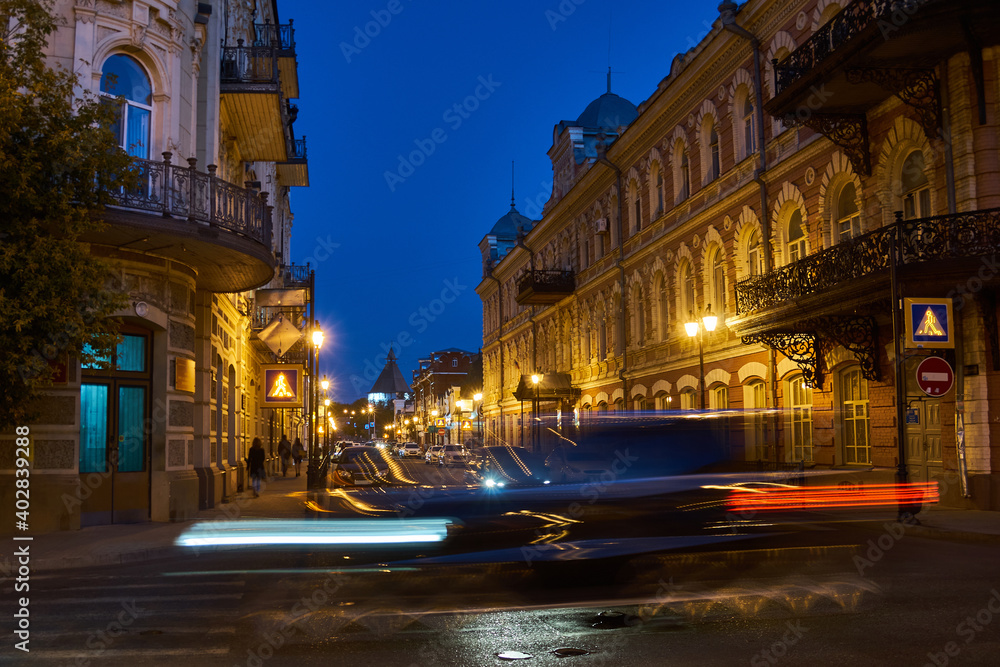 Fototapeta premium Cars passing by on city street