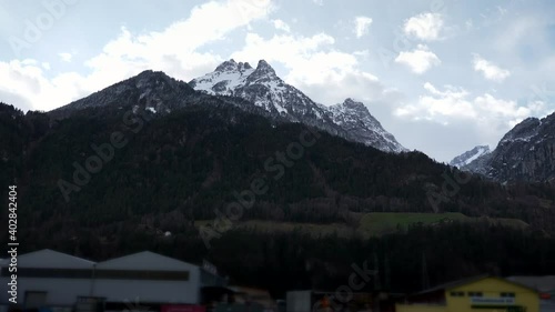 Hoch Geissberg - Scenic Snow capped Mountain Peak. Side View out of Car Window. Swiss Alps. Switzerland Europe. Slow motion photo