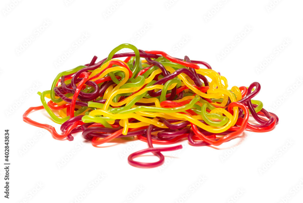 Tasty jelly spaghetti isolated on white background. Candy stripes. Tasty jelly spaghetti isolated on white background. Candy stripes.