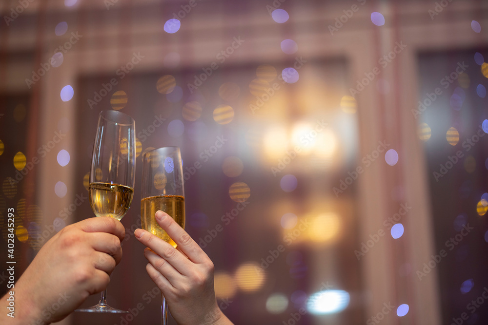 Close up view of man and women holding champagne glass. Love. Holiday.