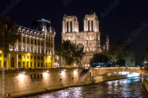 The Cathedral of Notre Dame and the River Seine illuminated at night