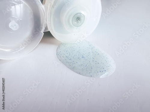 Micro plastic particles in a face scrub on a white background.