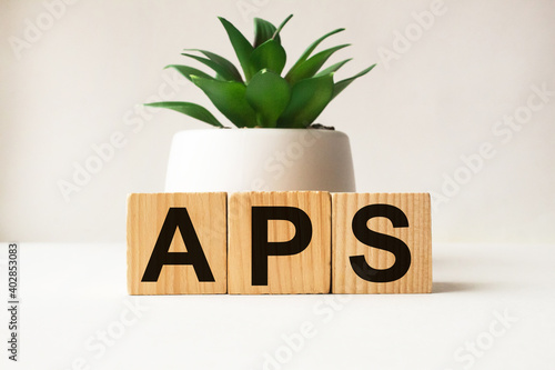wooden cubes with text APS . the medicine. medical concept