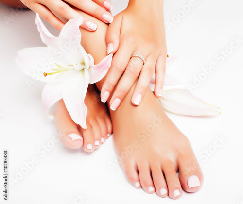 manicure pedicure with flower lily closeup isolated on white perfect shape hands spa salon © iordani