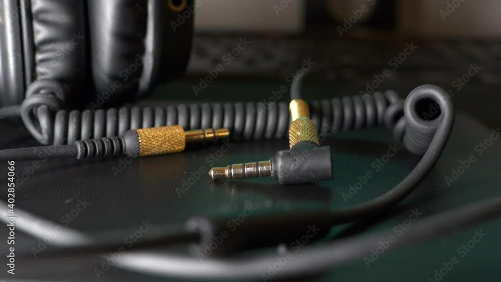 Close up of Headphone headset plug on desktop table Close up of Headphone headset plug on desktop table