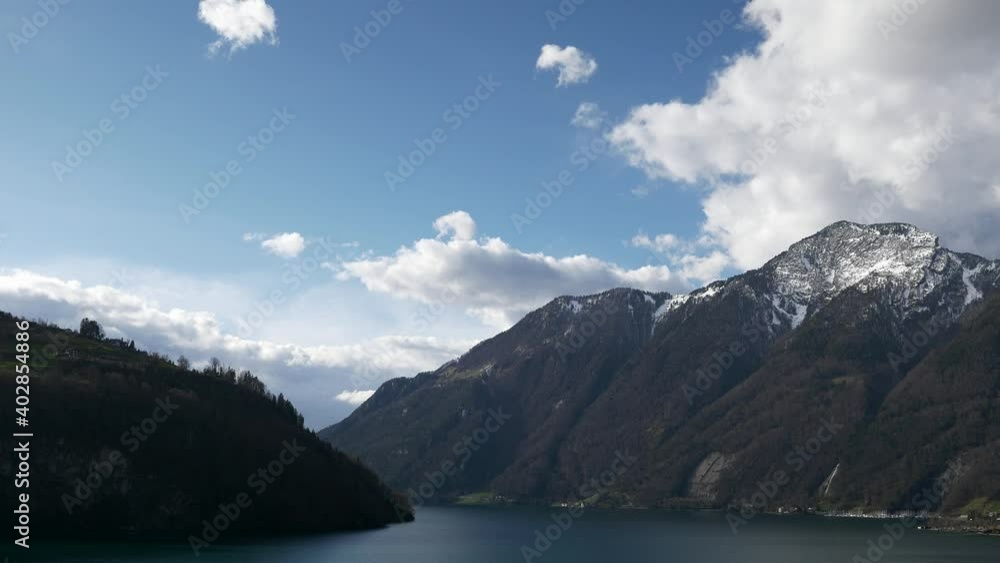 Mountain Lake Lucerne. Alps Switzerland Europe. View out of Car Moving on Highway Quay. Slow motion Mountain Lake Lucerne. Alps Switzerland Europe. View out of Car Moving on Highway Quay. Slow motion