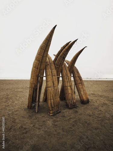 Traditional peruvian caballito de totora Balsa reed fishing boat raft canoe on Pimentel Beach Lambayeque Peru