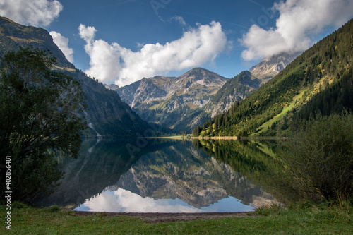  The Vilsalpsee in the morning in the nature reserve of the Tannheimer Valley in Tyrol / Austria