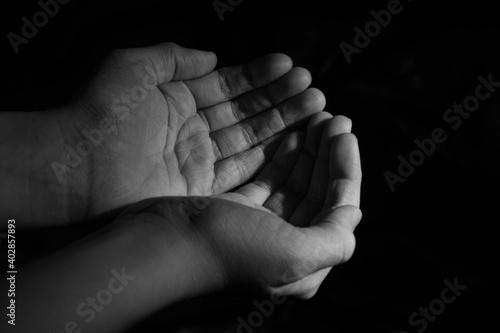 blank children hands held up in black white