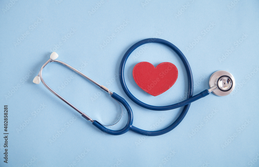 Red heart and stethoscope on the blue background. Red heart and stethoscope on the blue background.