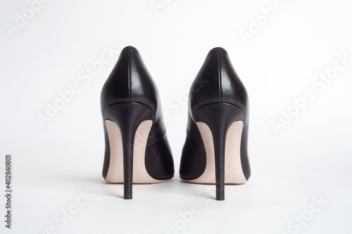 High heels back view. Black high heels on white background
