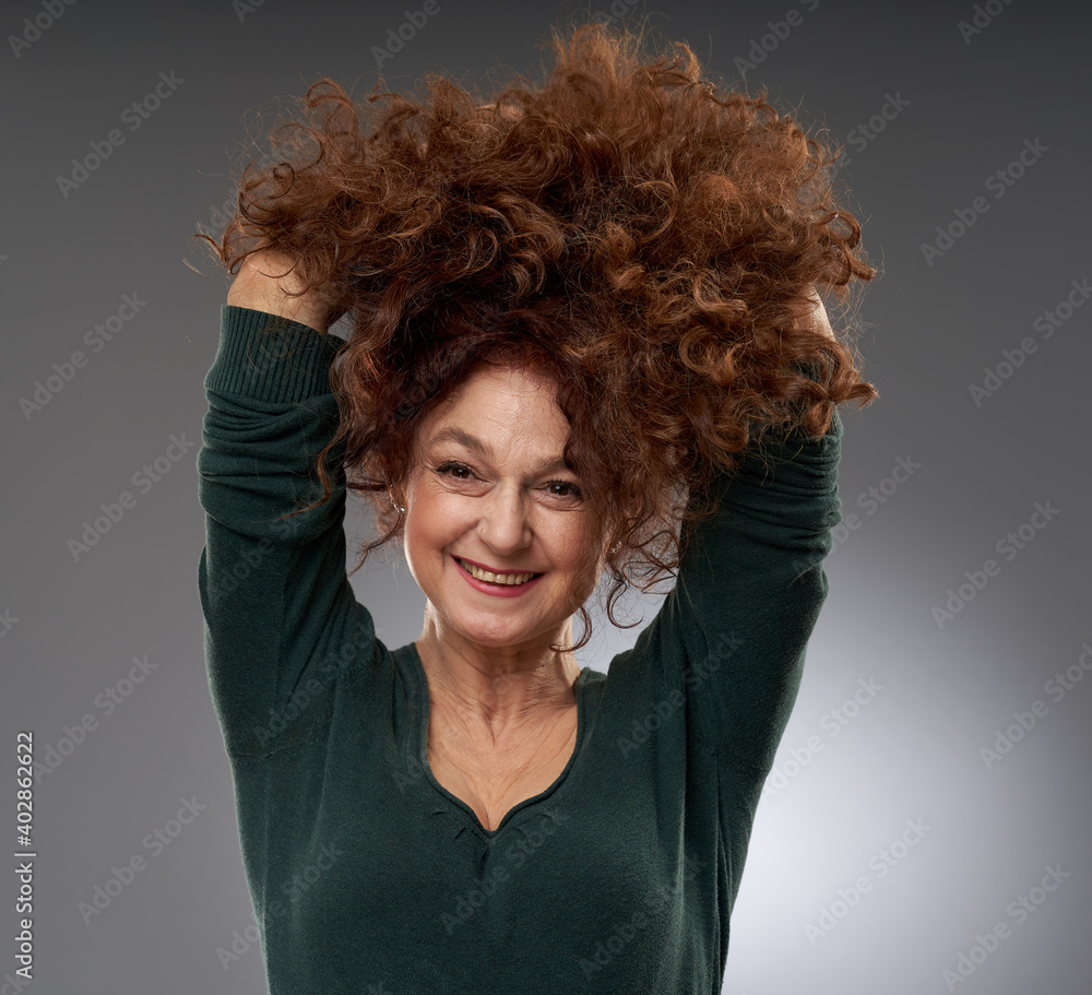 Senior woman on gray background - obrazy, fototapety, plakaty 
