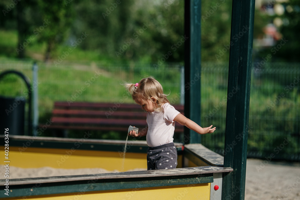 young blonde girl have fun on Children's Playground